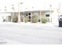 Charming single-story home with a covered entry and desert landscaping at 7807 E Main St # D-32, Mesa, AZ 85207