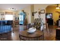 Open-concept living area with stylish furniture and a view to dining space at 7807 E Main St # D-32, Mesa, AZ 85207