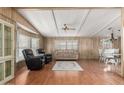 Spacious living room with wood-look floors, neutral tones, and comfortable seating arrangement at 8103 E Southern Ave # 119, Mesa, AZ 85209