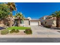 Charming single-story home featuring desert landscaping and a spacious three-car garage at 896 E Indian Wells Pl, Chandler, AZ 85249