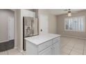 Bright kitchen featuring white cabinets, stainless steel appliances, and a center island at 896 E Indian Wells Pl, Chandler, AZ 85249