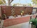 Lovely front patio area with decorative brickwork and beautiful plants at 10323 W Deanne Dr, Sun City, AZ 85351