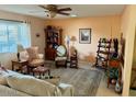 Comfortable living room with lots of natural light and neutral decor at 10323 W Deanne Dr, Sun City, AZ 85351