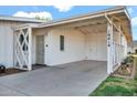 White painted carport with cross-hatched design detail at 10414 N 105Th Ave, Sun City, AZ 85351