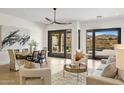 Bright and airy living room with modern furniture and sliding glass doors to the patio at 10819 E Butherus Drive --, Scottsdale, AZ 85255