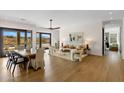 Open-concept living and dining area with light wood floors and plenty of natural light at 10819 E Butherus Drive --, Scottsdale, AZ 85255