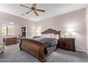 Spacious main bedroom with a large carved-wood bed frame and a separate office nook at 11034 E Natal Ave, Mesa, AZ 85209