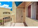 Apartment 249 featuring a secure door, window, and neutral exterior paint at 12221 W Bell Rd # 249, Surprise, AZ 85378