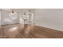 Bright living room featuring wood floors, fresh paint, and an open floorplan at 12221 W Bell Rd # 249, Surprise, AZ 85378
