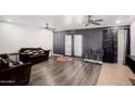 Open living area with plank floors, ceiling fans, and stylish decor at 13201 N 24Th Ave, Phoenix, AZ 85029