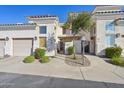 Attractive condo exterior with a gated entry and well-maintained landscaping at 1747 E Northern E Ave # 166, Phoenix, AZ 85020