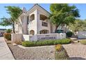 Beautiful two-story condo with desert landscaping and a community sign at 1747 E Northern E Ave # 166, Phoenix, AZ 85020