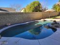 Refreshing backyard pool offers a private retreat with lush greenery and ample space for lounging at 17500 N 85Th Drive --, Peoria, AZ 85382