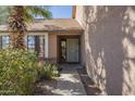 Inviting front entrance with well maintained landscaping and unique front door at 18194 N 59Th Ln, Glendale, AZ 85308
