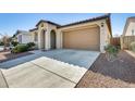 Inviting single-story house with a well-kept lawn and a two-car garage, in a peaceful neighborhood at 19685 W Roma Ave, Litchfield Park, AZ 85340