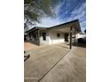 A well-maintained house featuring a spacious carport and an inviting, neutral color scheme at 2224 W Fairmount Ave, Phoenix, AZ 85015