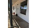 Charming front porch with brick, decorative plants, and secure entry door at 2224 W Fairmount Ave, Phoenix, AZ 85015