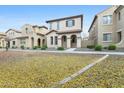 Tan-colored two-story home with a front yard covered in fallen leaves at 25824 N 54Th Ave, Phoenix, AZ 85083