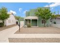 Well-maintained house with a desert landscape, charming curb appeal, and a cozy, inviting entrance at 2715 E Windsor Ave, Phoenix, AZ 85008