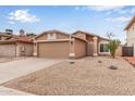 Single-story home with desert landscaping and a two-car garage, complemented by a well-maintained exterior at 3613 W Camino Real --, Glendale, AZ 85310