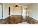 Spacious living area featuring tile floors and a mirrored closet at 3825 E Camelback Rd # 292, Phoenix, AZ 85018