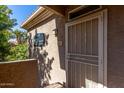 Front door features a security screen and a well-marked address for easy identification at 3830 E Lakewood Pkwy # 2116, Phoenix, AZ 85048