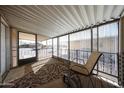 Enclosed patio with outdoor seating and wrought iron security screen at 652 S Ellsworth Rd # 92, Mesa, AZ 85208