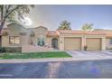 Inviting home featuring a tidy front yard, a covered porch, and an attached two-car garage at 1021 S Greenfield Rd # 1178, Mesa, AZ 85206