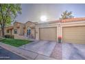 Attractive home boasts a cozy patio area, an attached garage, and a nicely kept lawn at 1021 S Greenfield Rd # 1178, Mesa, AZ 85206