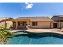 Enjoy a backyard with a pool and covered patio for outdoor entertaining in your new home at 11318 S Hopi Dr, Goodyear, AZ 85338