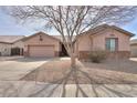 Lovely single-story home featuring a well-kept yard and a convenient two-car garage at 1629 E Prickly Pear Pl, Casa Grande, AZ 85122