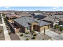 Inviting single-story home with stone accents, desert landscaping, and a two-car garage at 16430 W Alameda Rd, Surprise, AZ 85387