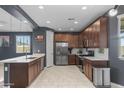 Well-lit kitchen with stainless steel appliances, ample cabinet space, and stylish backsplash at 16430 W Alameda Rd, Surprise, AZ 85387