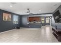 Spacious living room with neutral tile flooring, ample natural light, and modern finishes at 16430 W Alameda Rd, Surprise, AZ 85387