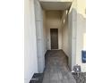 Front door exterior with tile walkway leading to the entryway at 17168 W Middlebury St, Surprise, AZ 85388