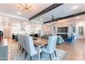 Spacious open-concept living area with seamless flow between the living room, dining area, and gourmet kitchen at 25751 S 227Th Way, Queen Creek, AZ 85142