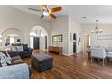 Spacious living room with hardwood floors, archways, and a modern ceiling fan at 2906 E Nora St, Mesa, AZ 85213