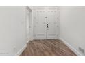 Home entryway features wood-look flooring and a double door closet at 3019 E Redfield Rd, Phoenix, AZ 85032
