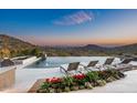 Stunning pool area with comfortable lounge chairs, desert views, and an outdoor spa at 42690 N 98Th Pl, Scottsdale, AZ 85262