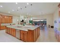 Open-concept kitchen with a large island, granite countertops, stainless steel appliances, and ample cabinet space at 6044 E Hodges St, Cave Creek, AZ 85331