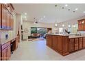 Gourmet kitchen featuring a large island, open layout to the living room, and a seamless connection to the outdoor space at 6044 E Hodges St, Cave Creek, AZ 85331
