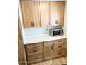 Mud room features bright cabinets, drawers, modern hardware, and a countertop at 805 S 82Nd Pl, Mesa, AZ 85208