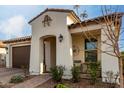 Inviting front exterior showcasing the front door and a cozy seating area, perfect for enjoying quiet mornings at 10657 E Texas Ave, Mesa, AZ 85212