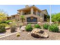 San Simeon Condominiums signage with desert landscaping in front of the building at 16013 S Desert Foothills Pkwy # 1133, Phoenix, AZ 85048