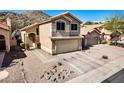 Beautiful two-story home with a two-car garage, landscaped front yard, and a welcoming entrance, showcasing curb appeal at 16834 S 20Th Pl, Phoenix, AZ 85048