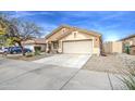 Inviting one-story home with desert landscaping, ample parking, and a well-maintained front yard at 17526 W Coyote Trail Dr, Goodyear, AZ 85338