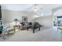 Comfortable living room featuring neutral tones, carpet flooring, and classic furnishings at 1847 Leisure World --, Mesa, AZ 85206