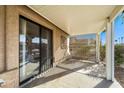 Relaxing covered patio space with sliding glass doors providing seamless indoor-outdoor flow at 1847 Leisure World --, Mesa, AZ 85206