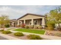 Charming home with a two-car garage, well-maintained landscaping, and a welcoming front porch at 20652 W Clearstream Dr, Buckeye, AZ 85396