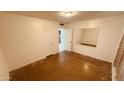Bright bedroom featuring neutral walls, closet, and doorway to the bathroom at 2502 W Jefferson St, Phoenix, AZ 85009